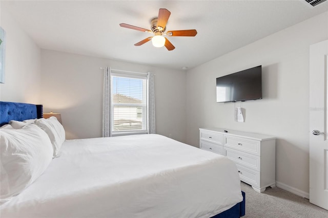 bedroom featuring ceiling fan and light colored carpet