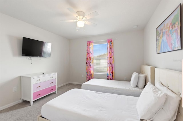 bedroom featuring light colored carpet and ceiling fan