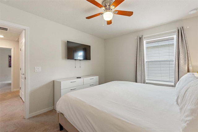 bedroom with light carpet and ceiling fan