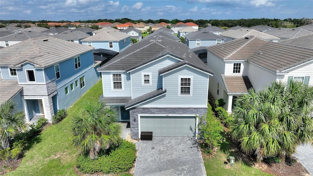 view of front of property featuring a front yard and a garage