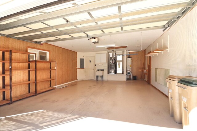 garage with a garage door opener and gas water heater