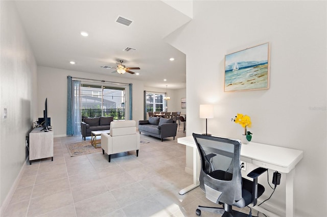 tiled home office with ceiling fan with notable chandelier