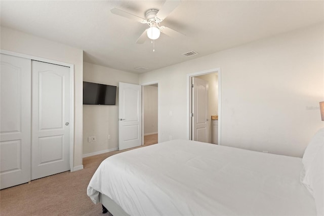 carpeted bedroom with a closet and ceiling fan