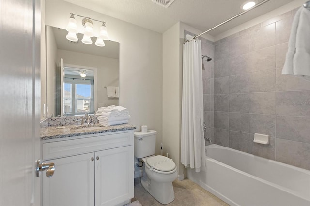 full bathroom with shower / bathtub combination with curtain, tile flooring, a textured ceiling, vanity with extensive cabinet space, and toilet