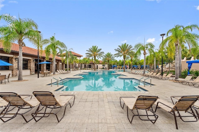 view of swimming pool with a patio