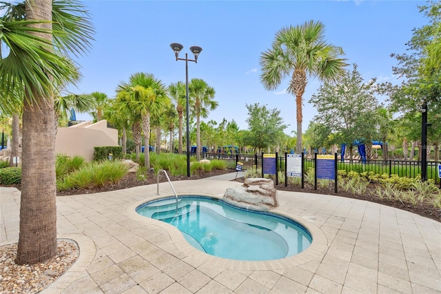 view of swimming pool featuring a patio