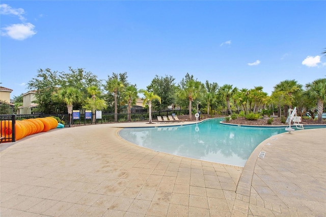 view of swimming pool featuring a patio area