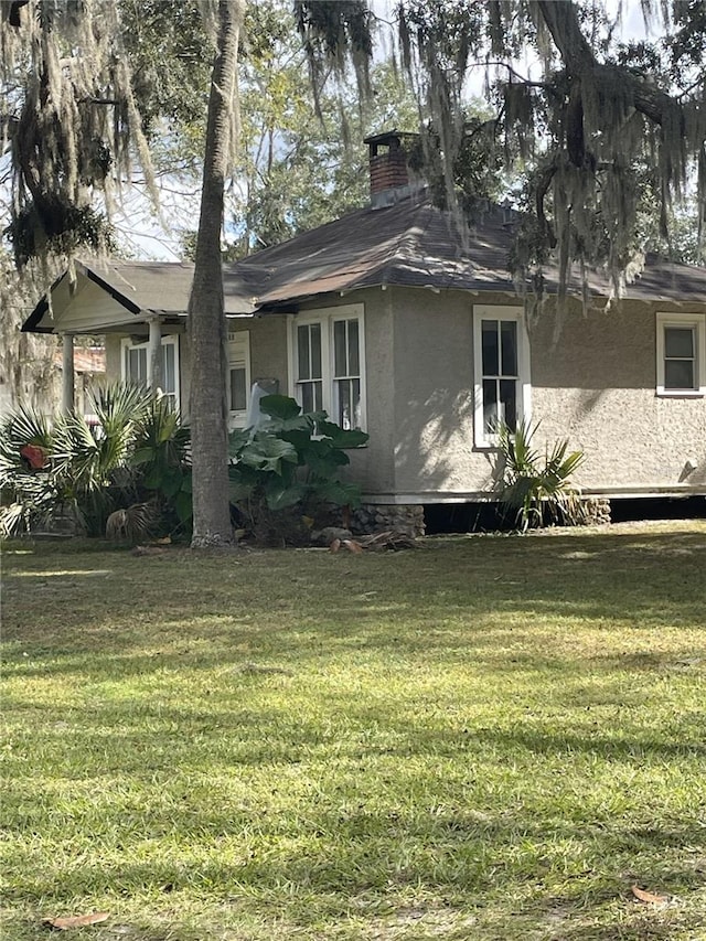 exterior space featuring a front lawn