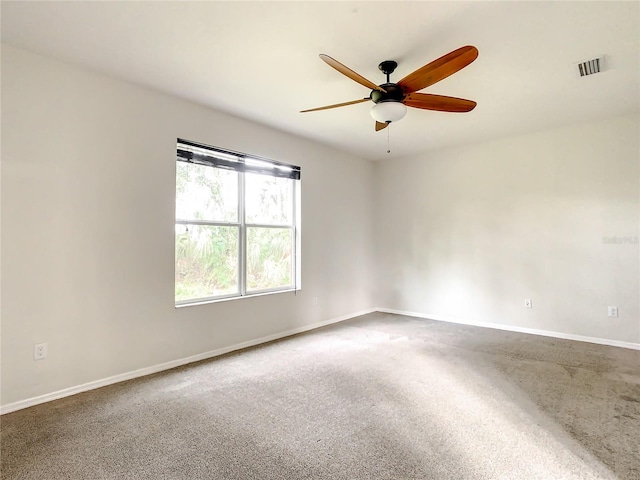 unfurnished room with ceiling fan and carpet floors