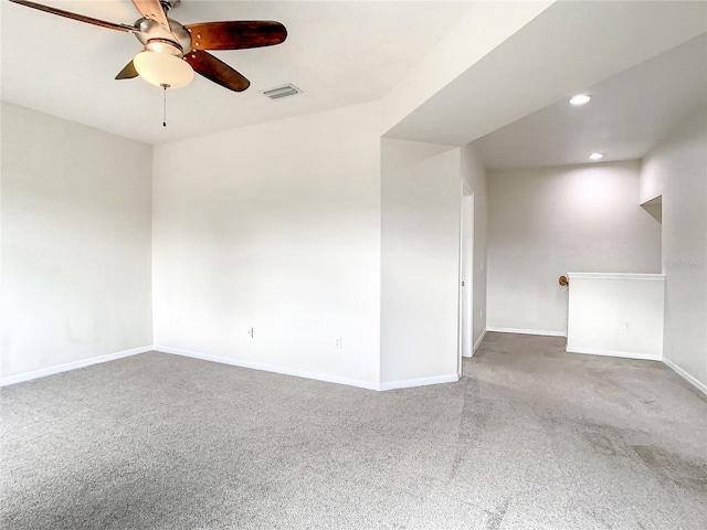 carpeted empty room featuring ceiling fan