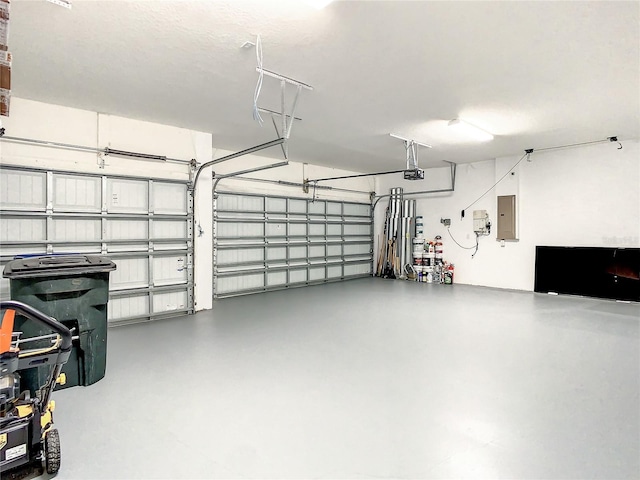 garage with electric panel and a garage door opener