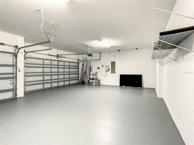 garage with electric panel and a garage door opener