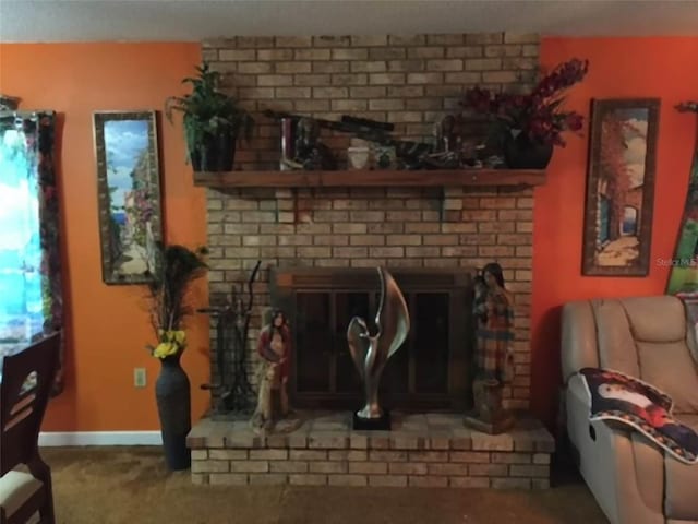 carpeted living room with brick wall and a fireplace