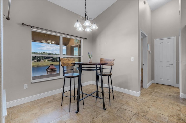 10120 Lakeshore Dr, Clermont, FL 34711 - dining room featuring high vaulted ceiling and a chandelier