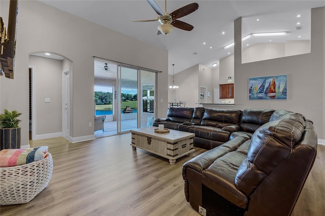 10120 Lakeshore Dr, Clermont, FL 34711 - living area featuring ceiling fan, high vaulted ceiling, light wood-style flooring, arched walkways, and recessed lighting
