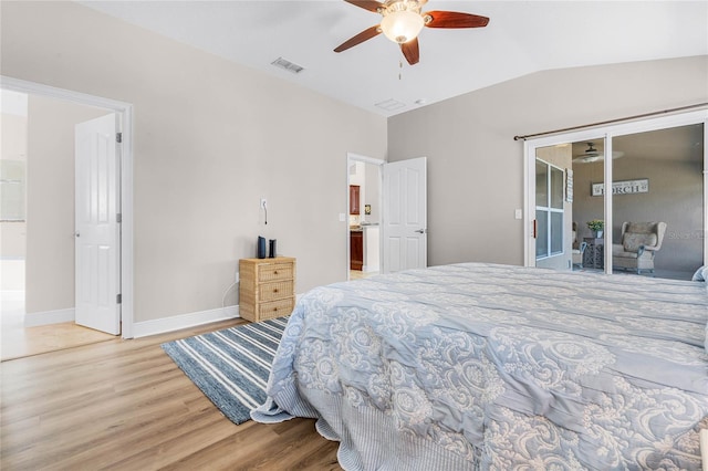 10120 Lakeshore Dr, Clermont, FL 34711 - bedroom featuring wood finished floors, access to exterior, lofted ceiling, and a ceiling fan