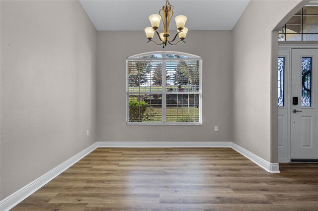 10120 Lakeshore Dr, Clermont, FL 34711 - entryway featuring a chandelier and wood finished floors