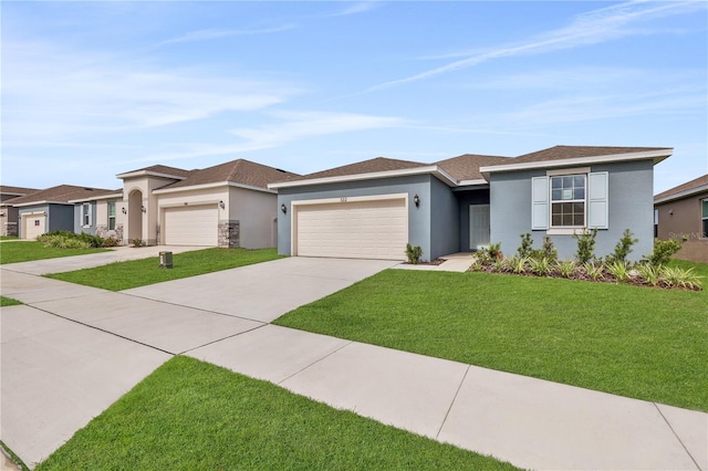 prairie-style home with a front yard and a garage