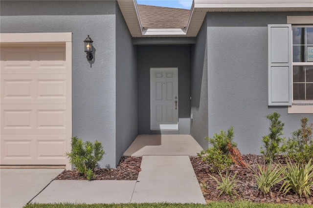 entrance to property featuring a garage