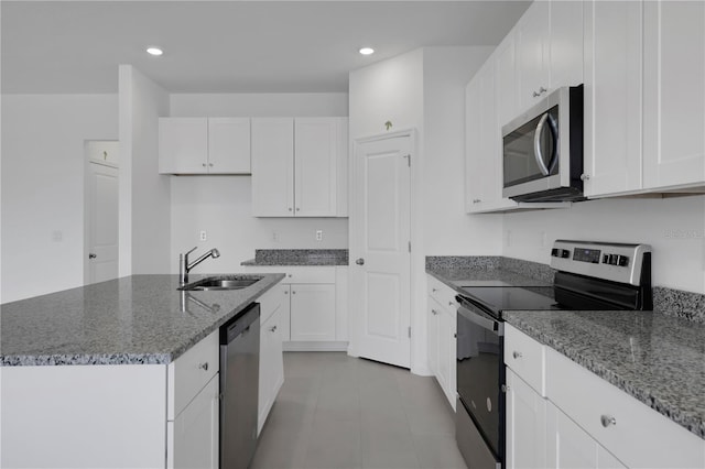 kitchen featuring white cabinets, stainless steel appliances, and sink