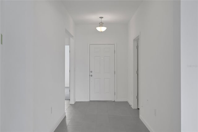 hallway featuring light tile patterned floors