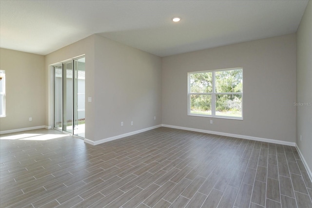 empty room with hardwood / wood-style floors