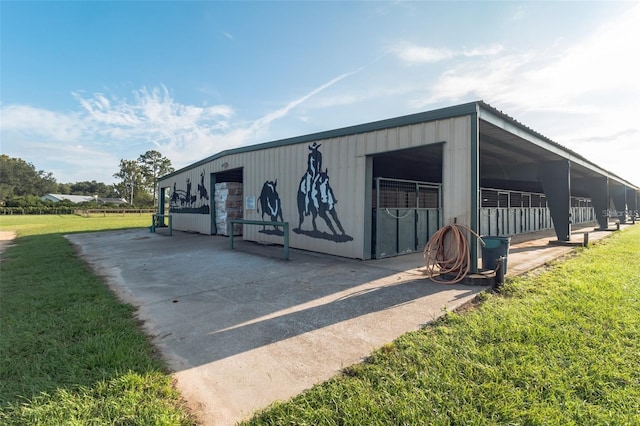 exterior space featuring a yard and an outdoor structure