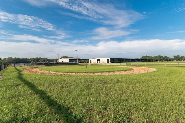 view of yard with a rural view