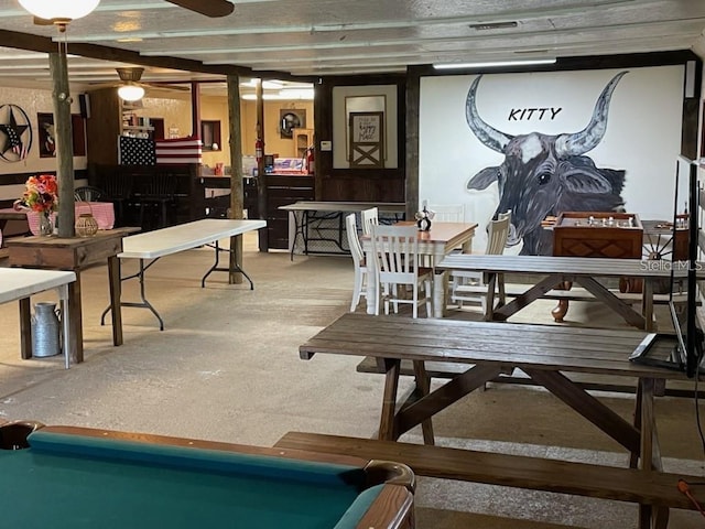 dining area with ceiling fan and pool table