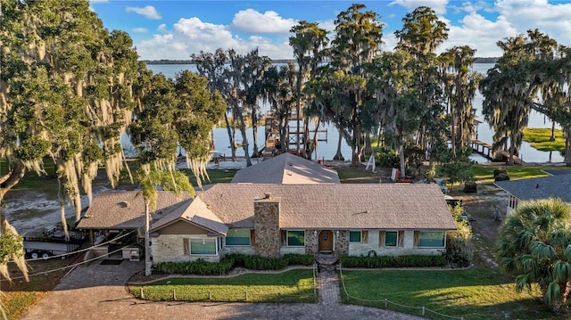 view of front facade with a water view and a front yard