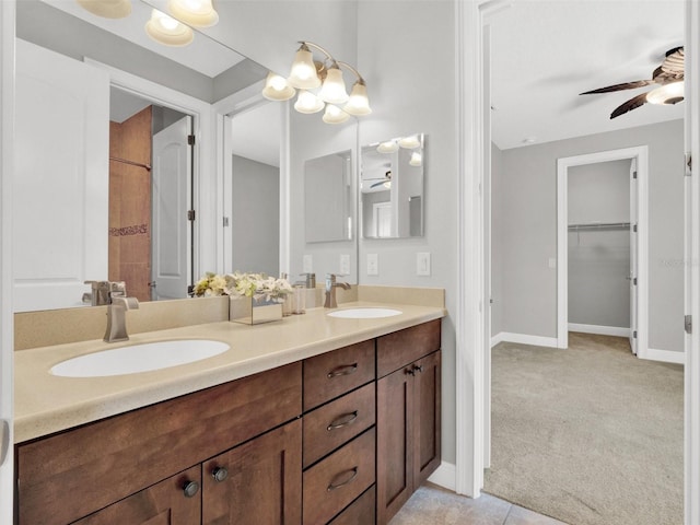 bathroom with tile patterned floors, ceiling fan, and vanity