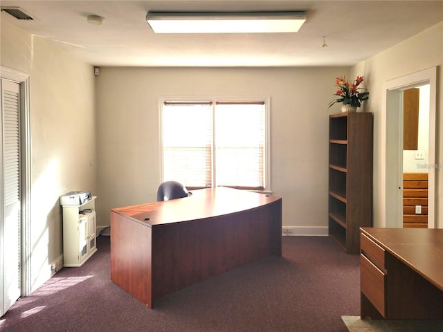 unfurnished office featuring dark colored carpet