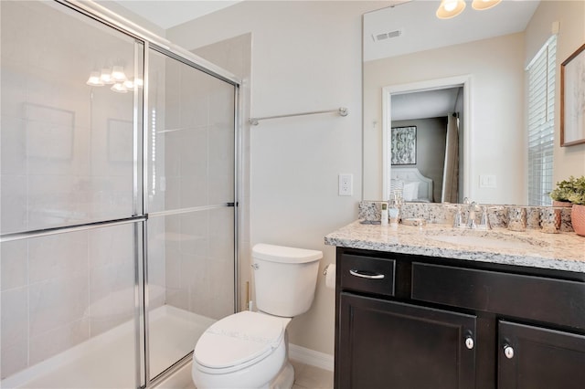 bathroom with toilet, vanity, and an enclosed shower