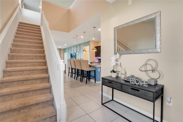 staircase with tile patterned floors