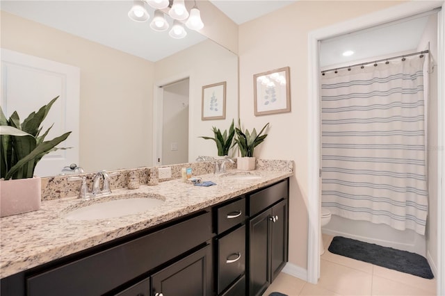 full bathroom featuring toilet, vanity, tile patterned flooring, and shower / bathtub combination with curtain