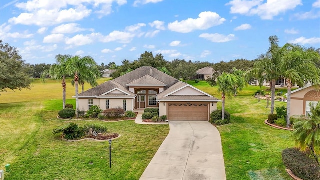 view of front of home with a garage and a front yard