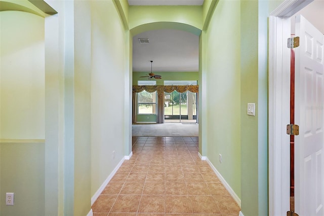 hallway featuring light tile patterned flooring