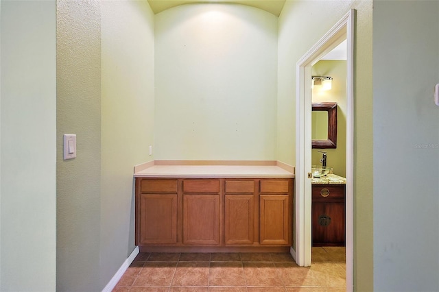 interior space featuring tile patterned flooring and vanity