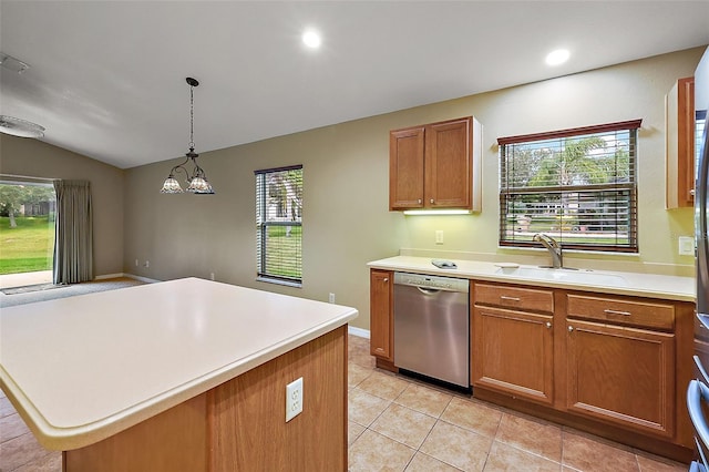 kitchen featuring lofted ceiling, hanging light fixtures, a center island, stainless steel dishwasher, and light tile patterned floors