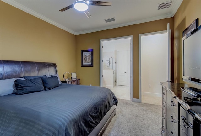 carpeted bedroom featuring ceiling fan, ensuite bath, and ornamental molding