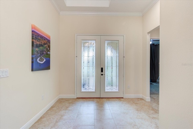 tiled entryway featuring ornamental molding and french doors