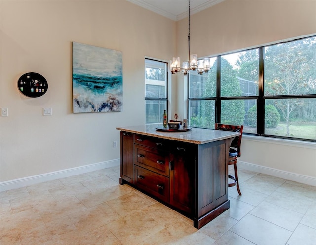 dining area featuring light tile patterned floors, ornamental molding, a chandelier, and a wealth of natural light