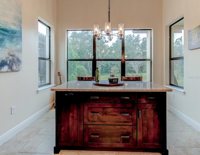 tiled dining area with a notable chandelier