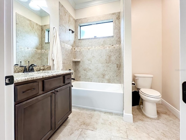 full bathroom featuring vanity, crown molding, tile patterned flooring, tiled shower / bath combo, and toilet