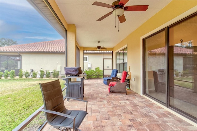 view of patio / terrace featuring ceiling fan and grilling area