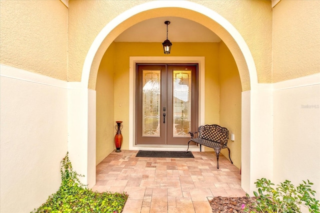 entrance to property featuring french doors