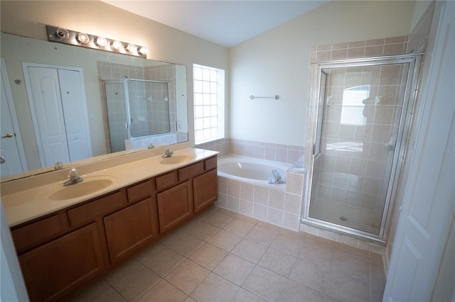 bathroom featuring vanity, lofted ceiling, tile patterned floors, and separate shower and tub