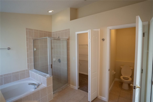 bathroom with tile patterned floors, toilet, and independent shower and bath