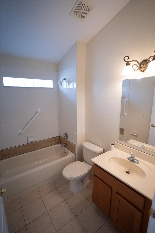 full bathroom featuring lofted ceiling, tiled shower / bath combo, vanity, toilet, and tile patterned floors