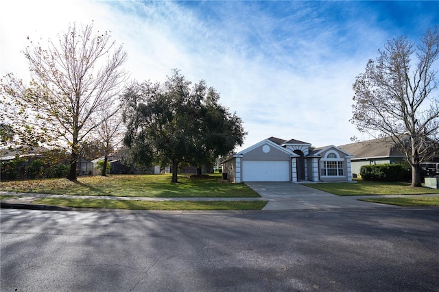 ranch-style house featuring a garage and a front yard